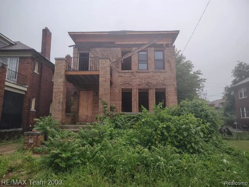 Brick two-family house mid renovation, Detroit, Michigan