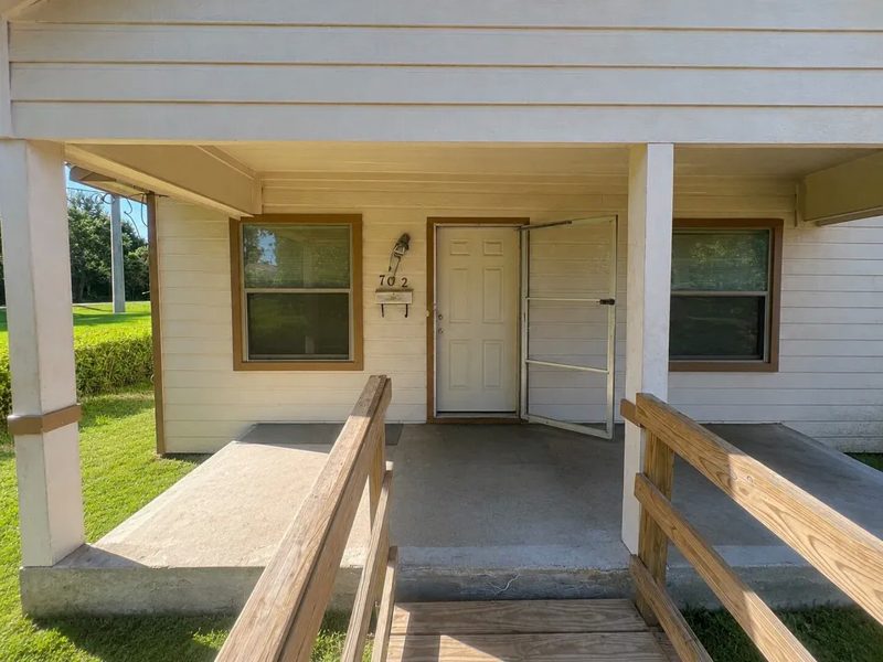 Single storey house behind a chain link fence, Houston, Texas